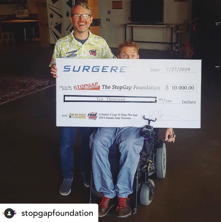 Presenting the $10,000 cheque to the StopGap Foundation