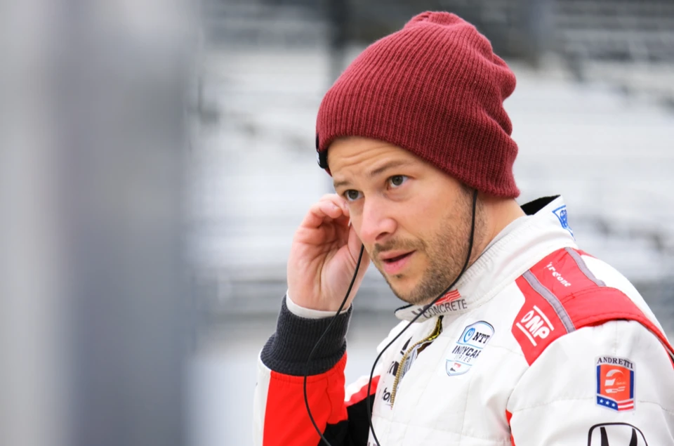 Marco Andretti listening on the radio